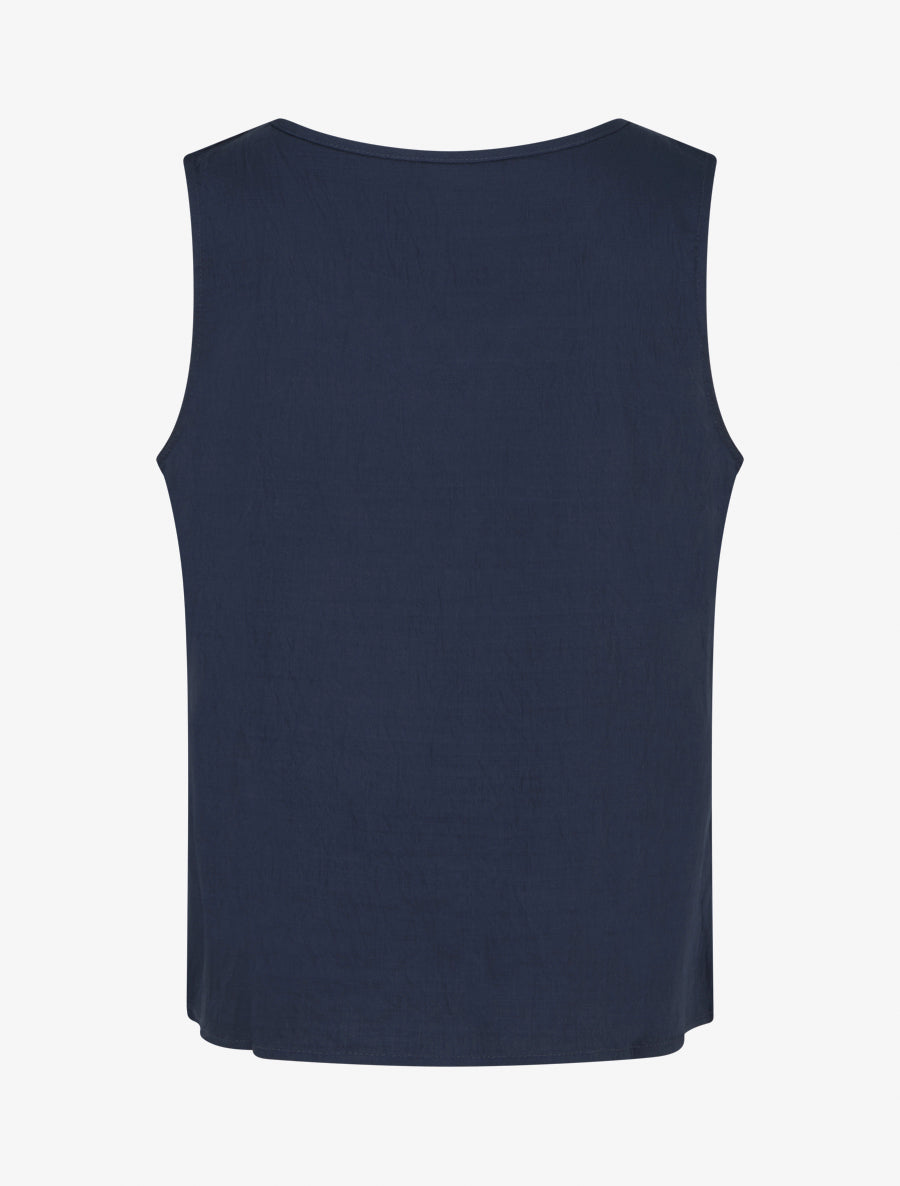 Top liso con detalles de bordados en forma de olas - Azul marino