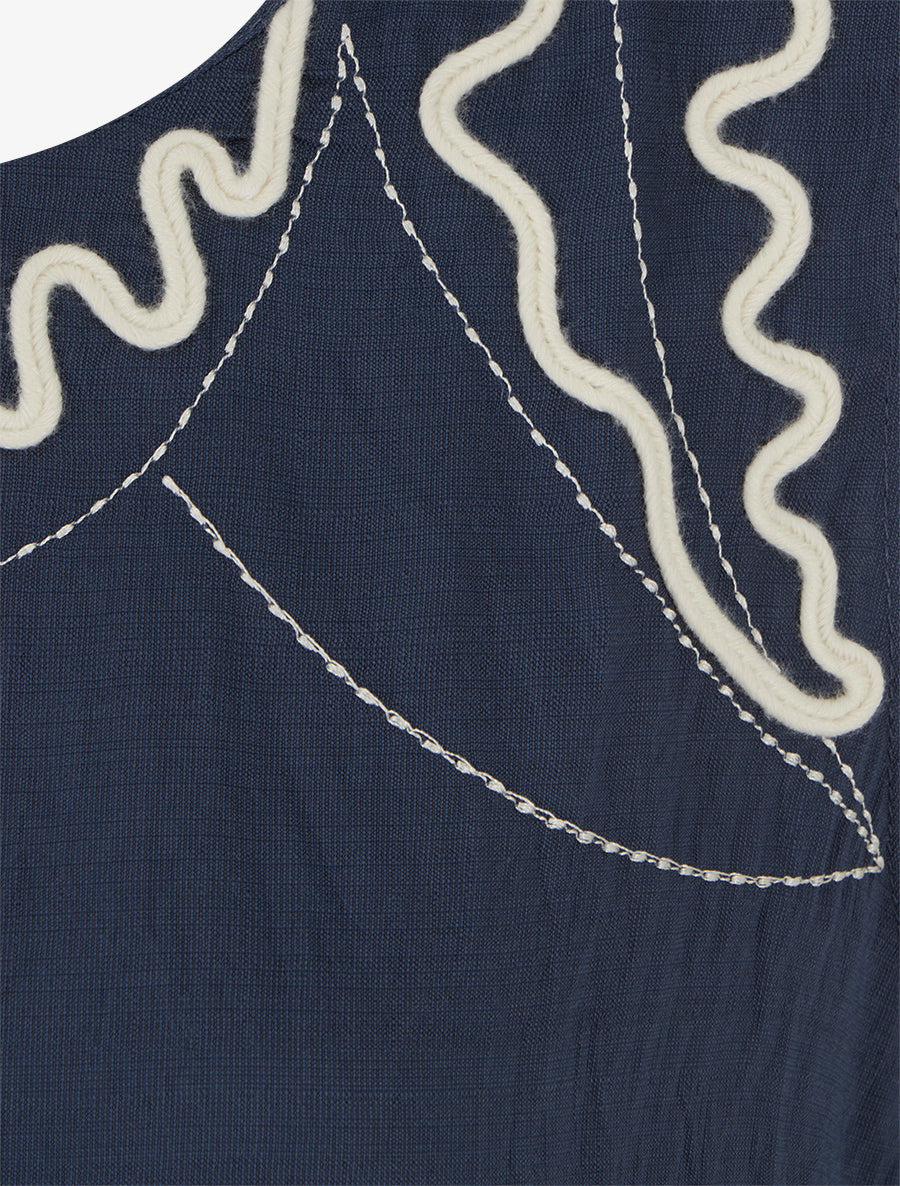 Top liso con detalles de bordados en forma de olas - Azul marino